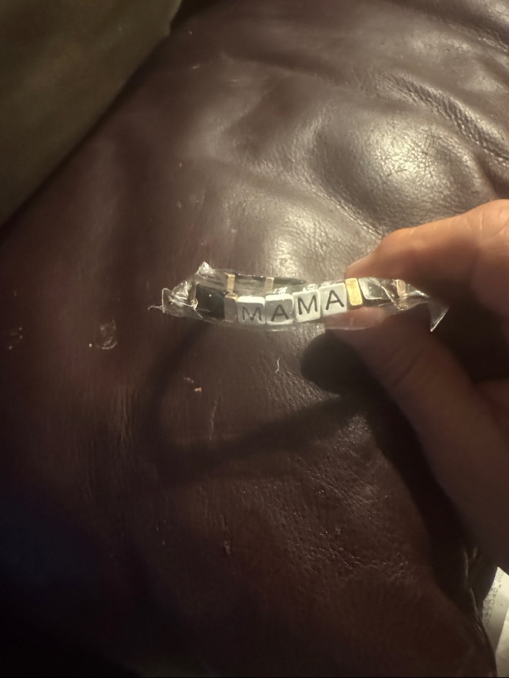 Plunder 'MAMA' Beaded Bracelet in Black, White & Gold says MAMA on it